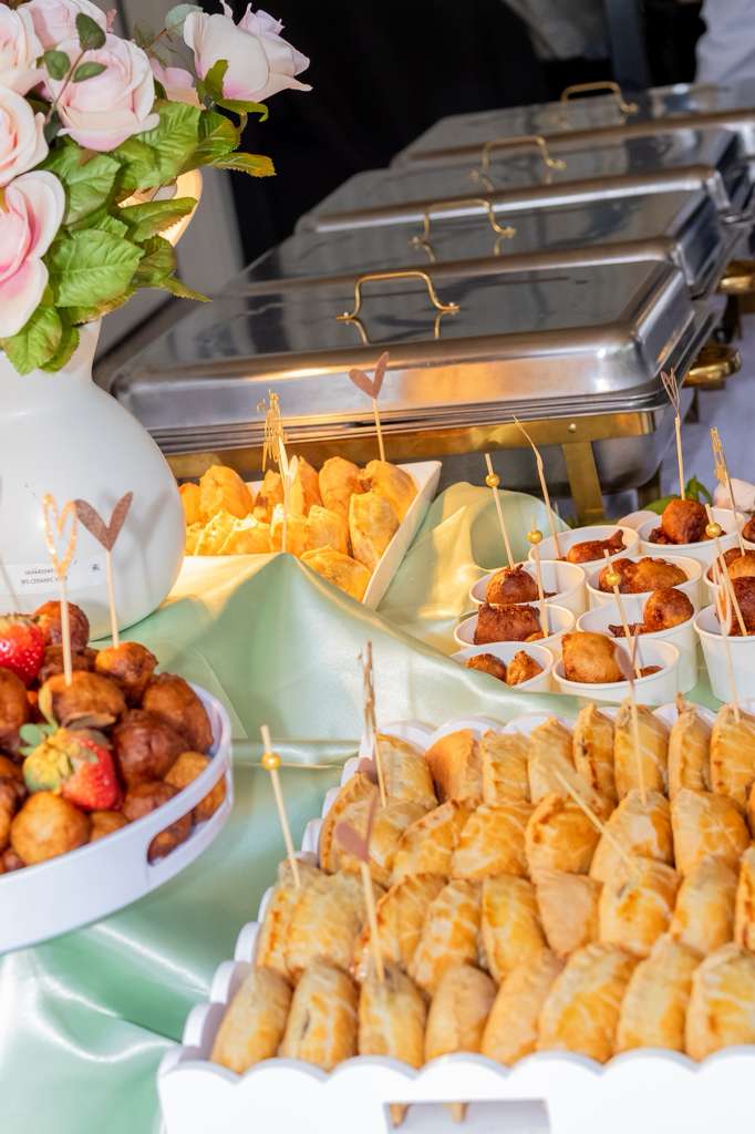 Styled Nigerian appetizer table with chafing dishes